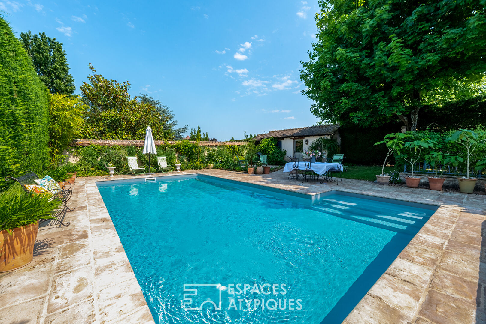 Stone family house with swimming pool and outbuildings