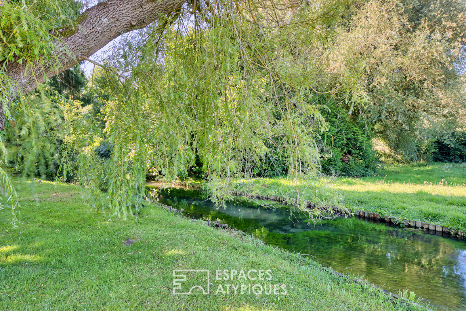 Property crossed by the river in one of the most beautiful villages in France