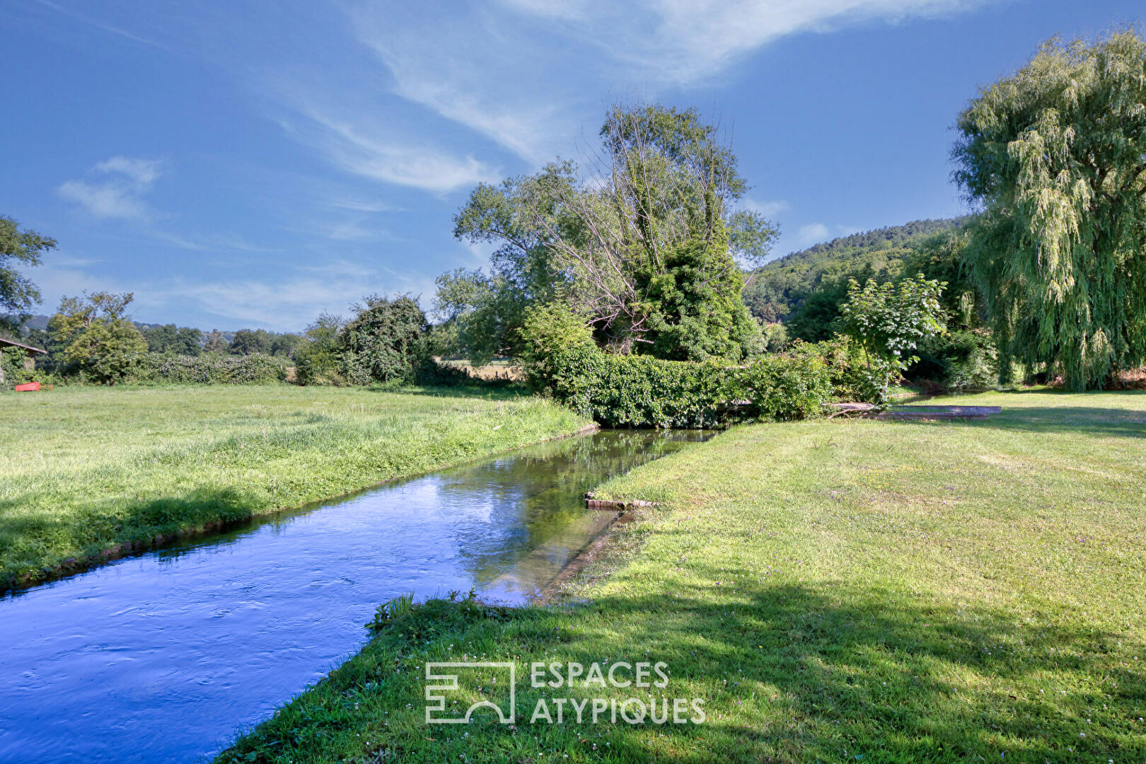 Property crossed by the river in one of the most beautiful villages in France