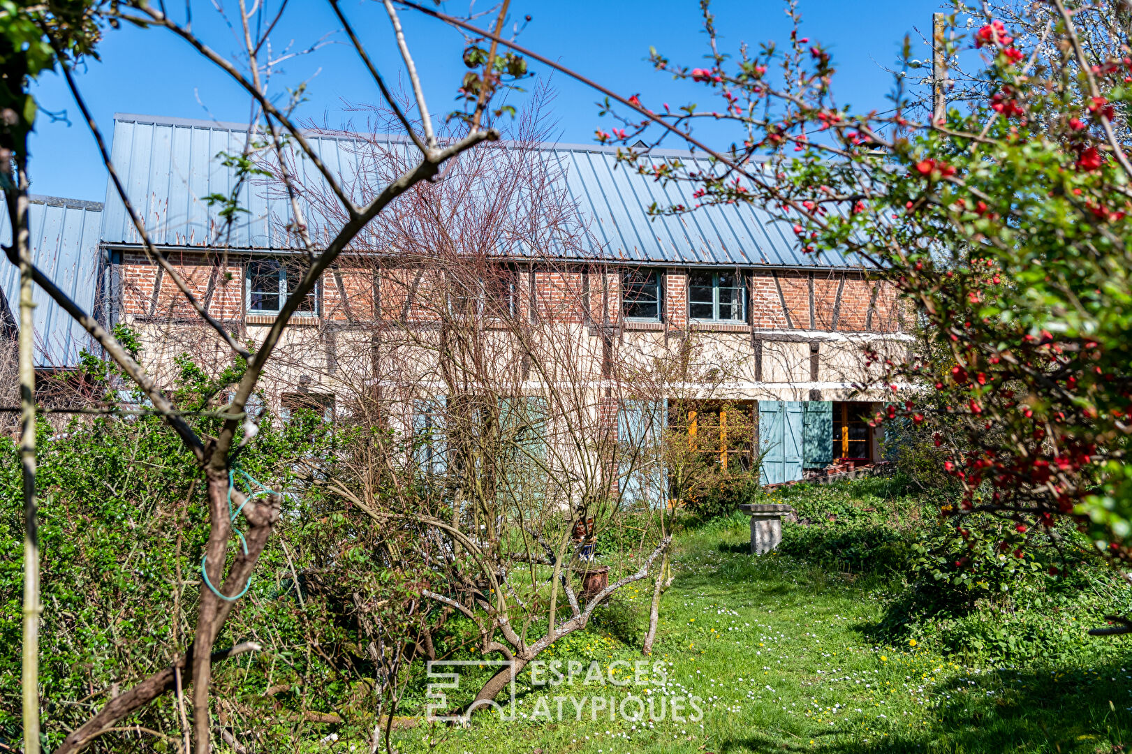 Former toy factory and its belvedere at the edge of the water.