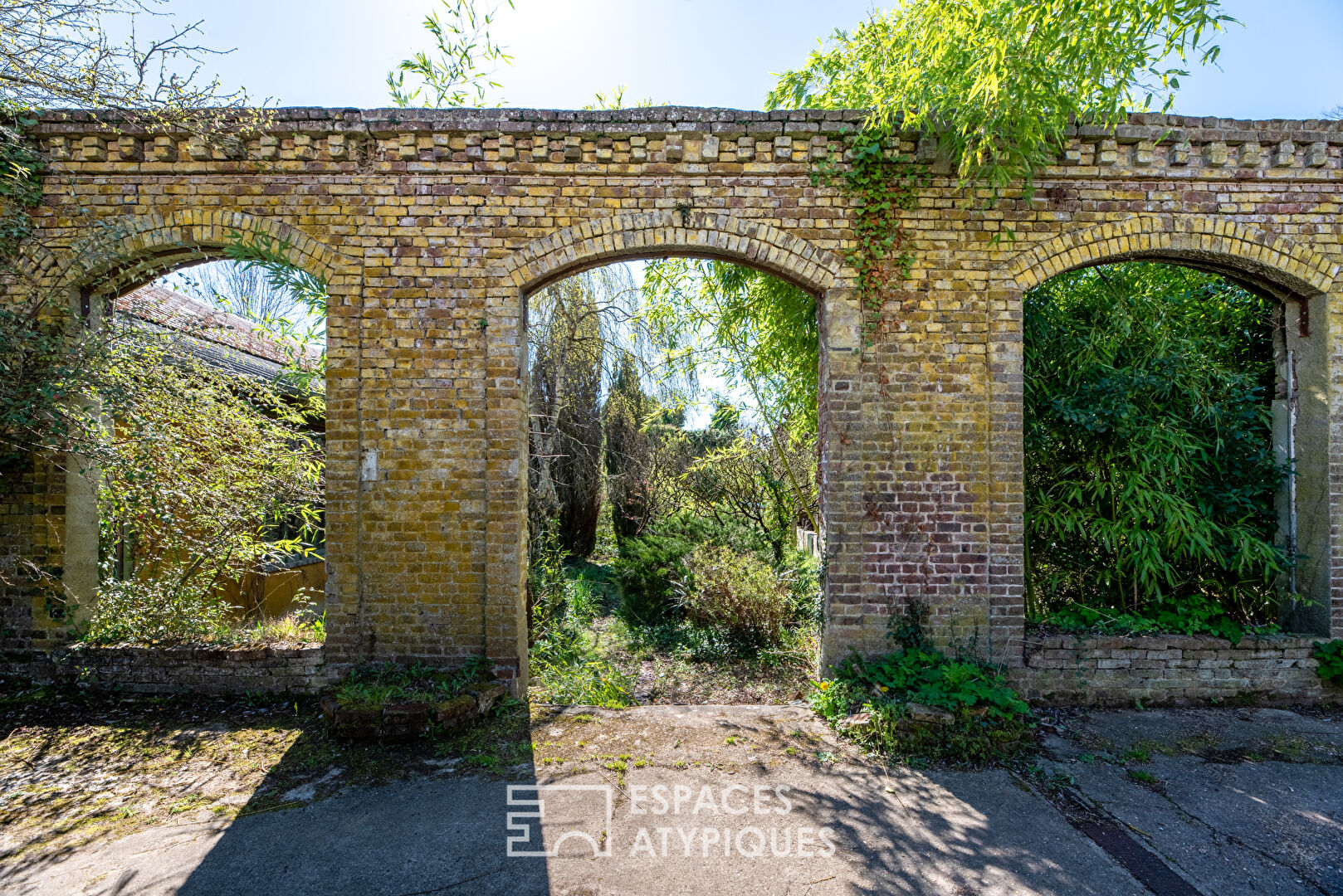 Former toy factory and its belvedere at the edge of the water.