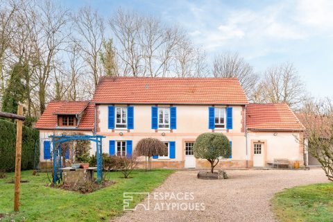 Propriété singulière avec son jardin arboré