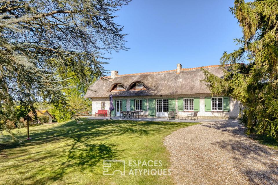 Élégante chaumière et son parc arboré