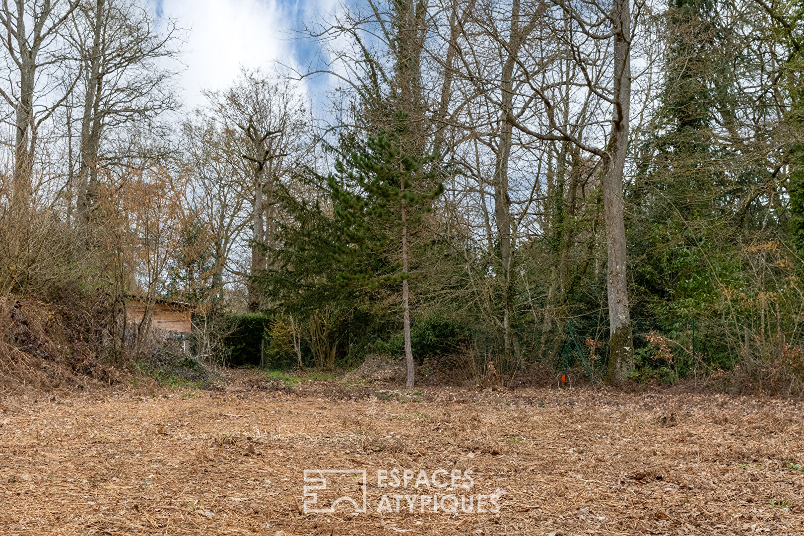 Rare building land with trees in the heart of the village