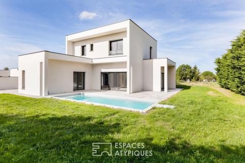 New contemporary home with a pool at the end of a cul-de-sac
