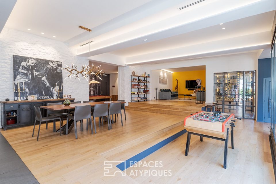 Magnifique loft de 244m² totalement rénové avec patio et parking