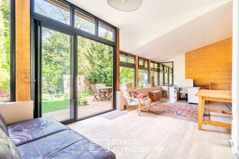 Maison familiale avec véranda et jardin bucolique
