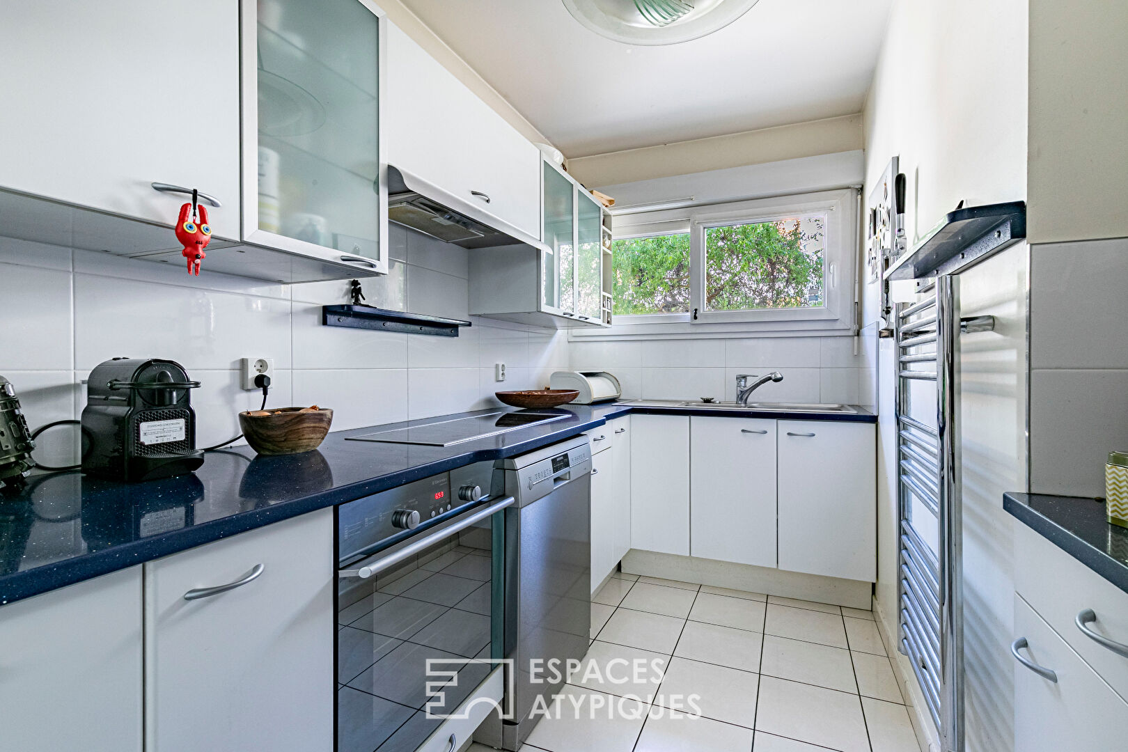 Maison en copropriété avec terrasse ombragée et garage en coeur de ville