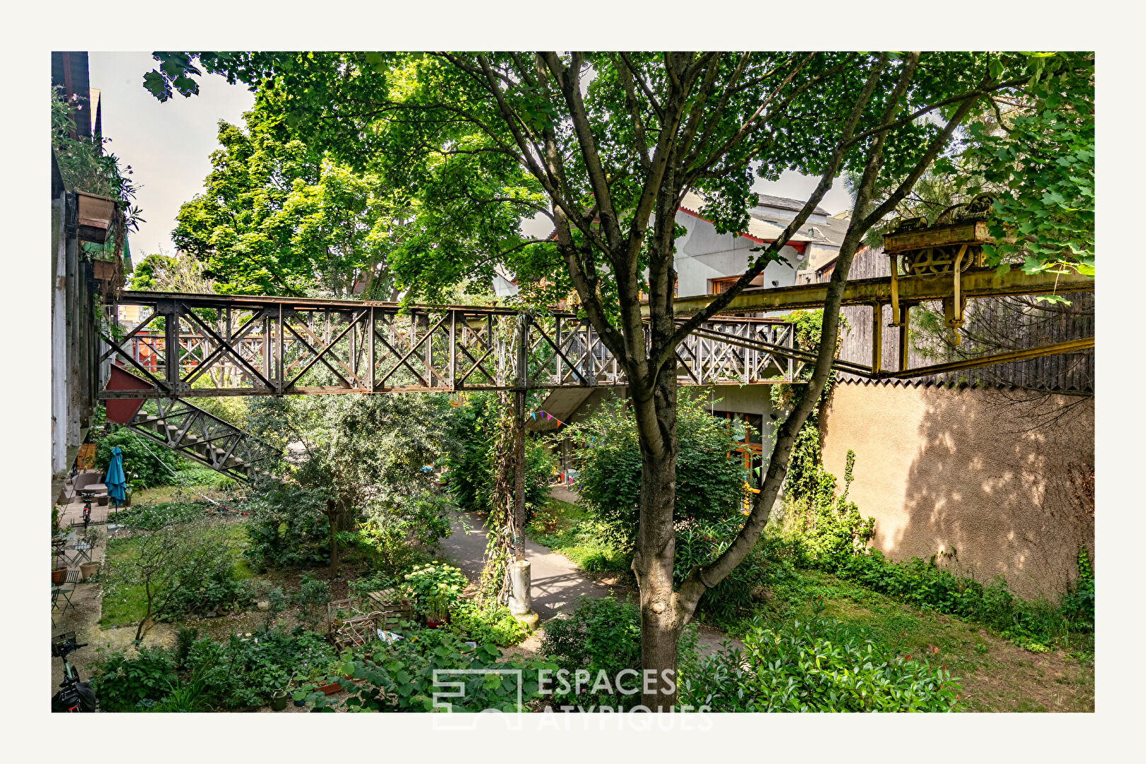 Architect-designed duplex loft and top floor overlooking a lush garden