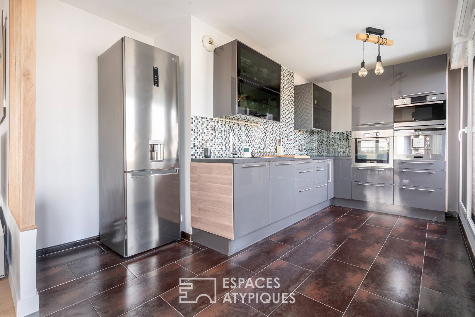 Appartement en dernier étage avec terrasse face à la Seine