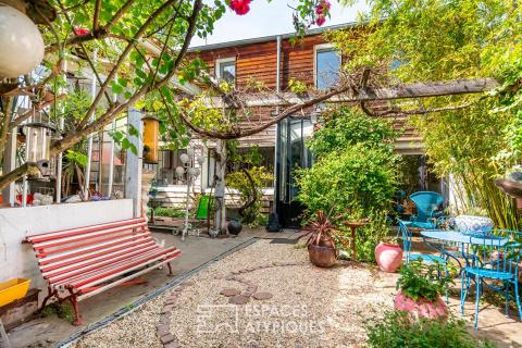 Maison avec dépendance et atelier autour d&rsquo;un jardin arboré