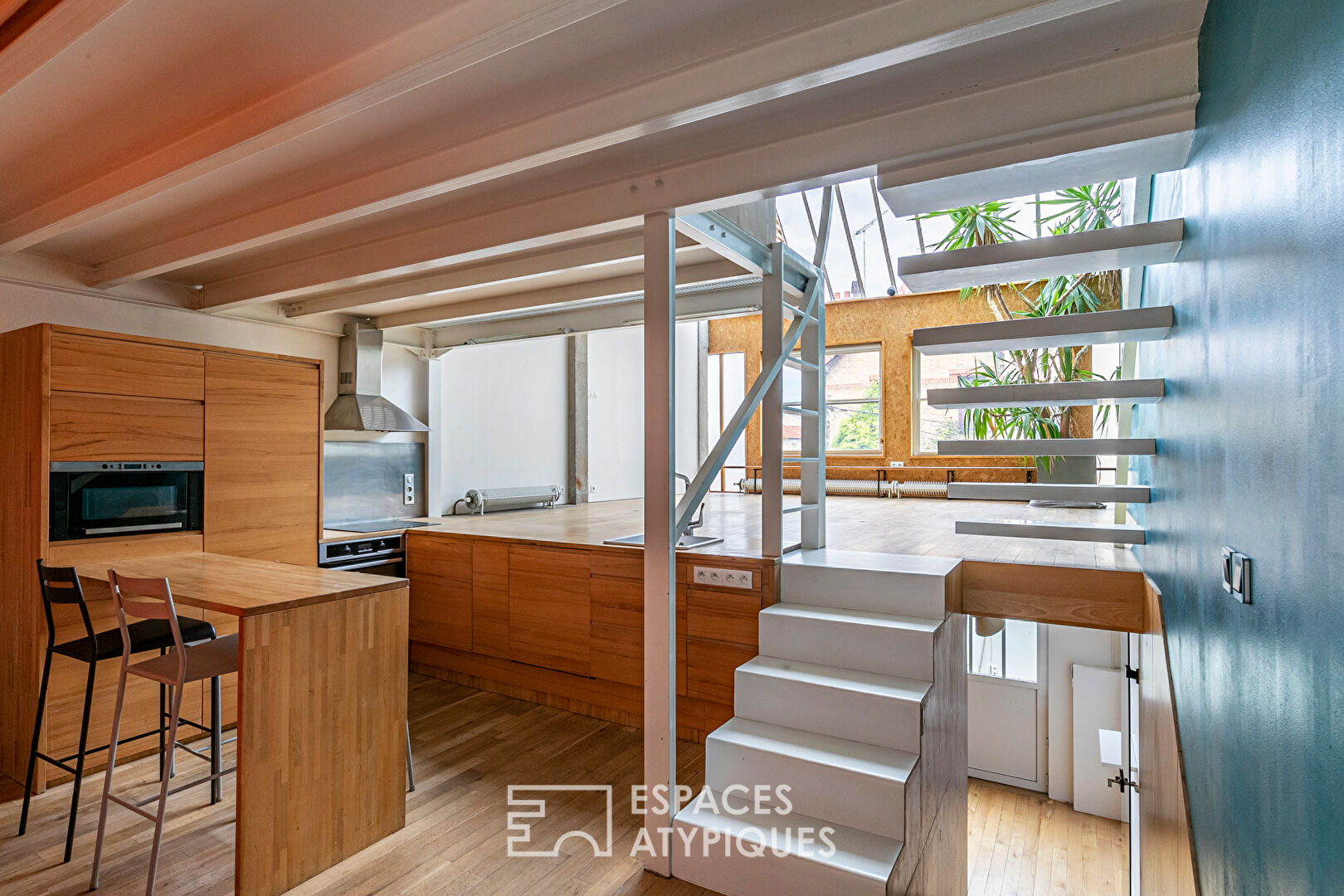 Artist’s loft with cascading glass roofs
