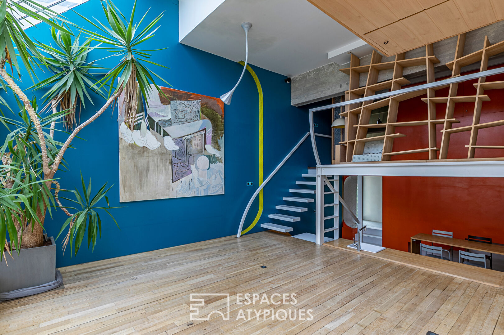 Artist’s loft with cascading glass roofs