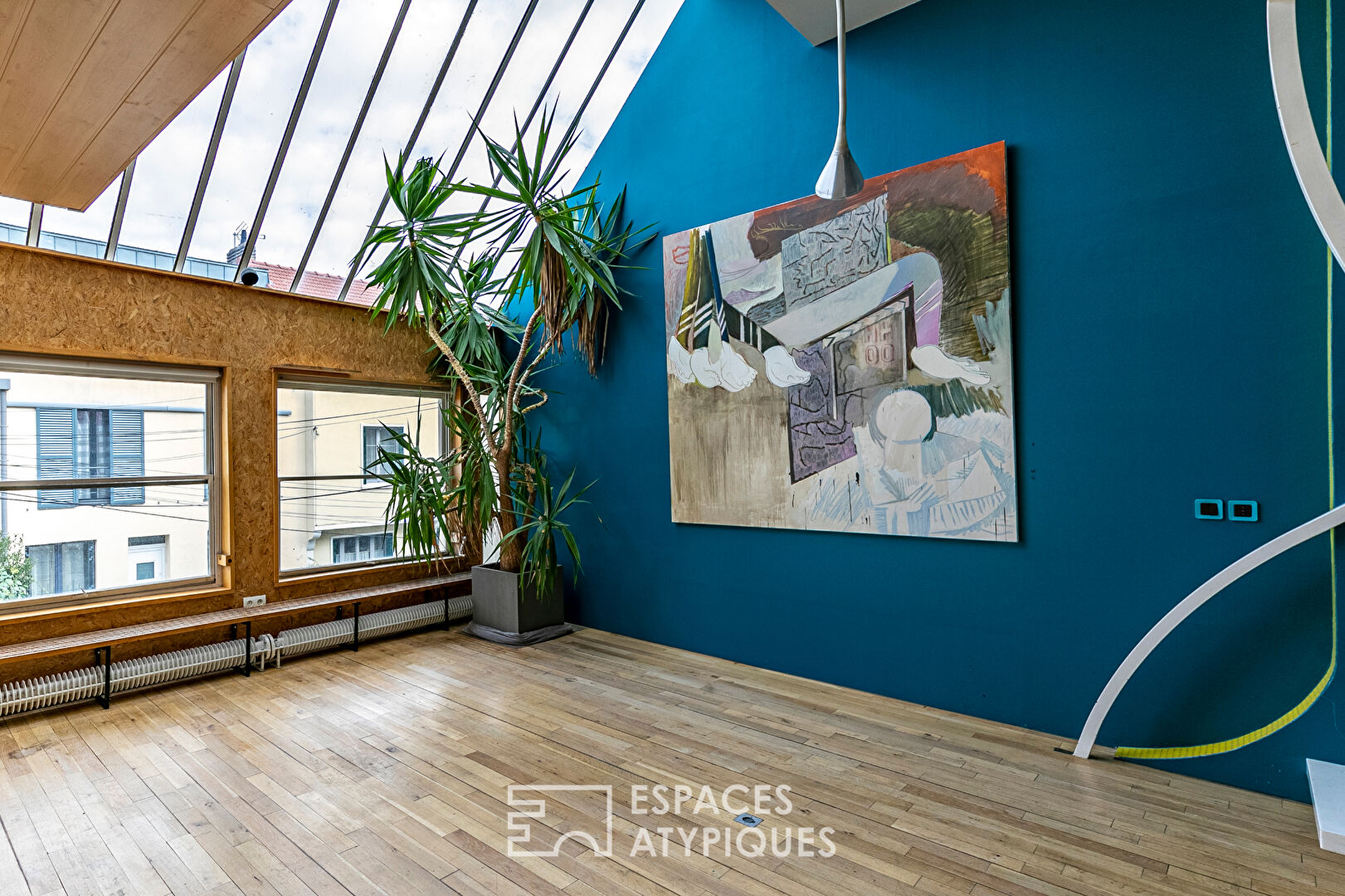 Artist’s loft with cascading glass roofs