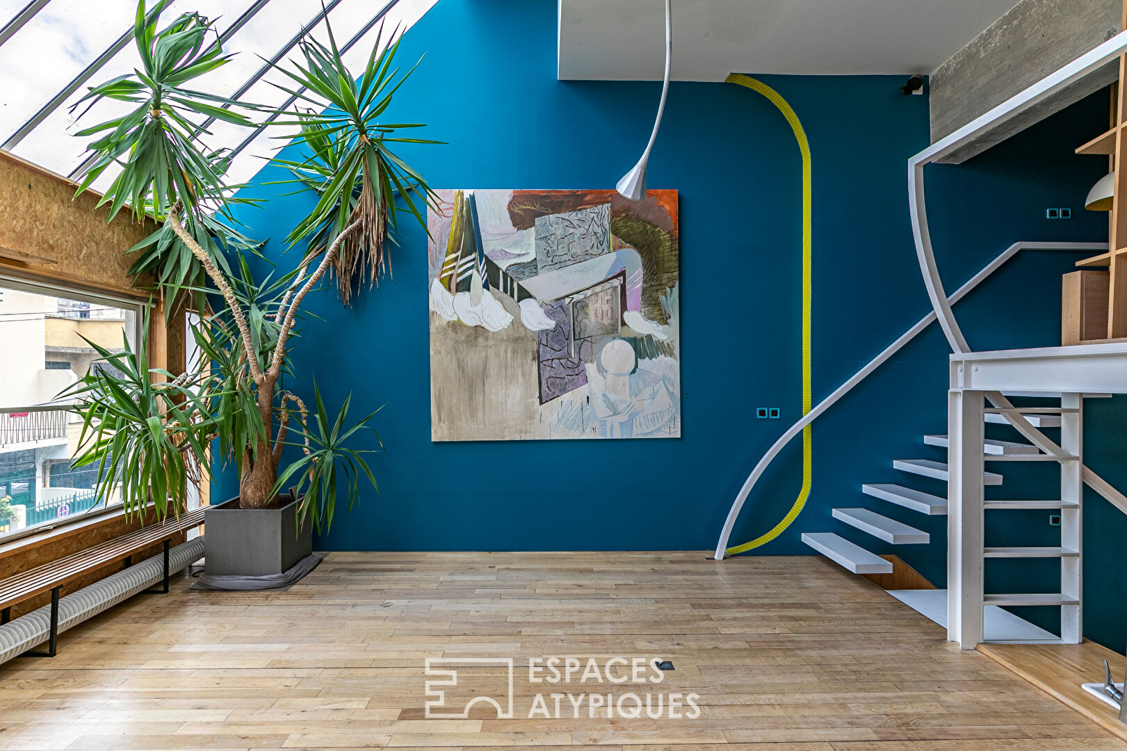 Artist’s loft with cascading glass roofs
