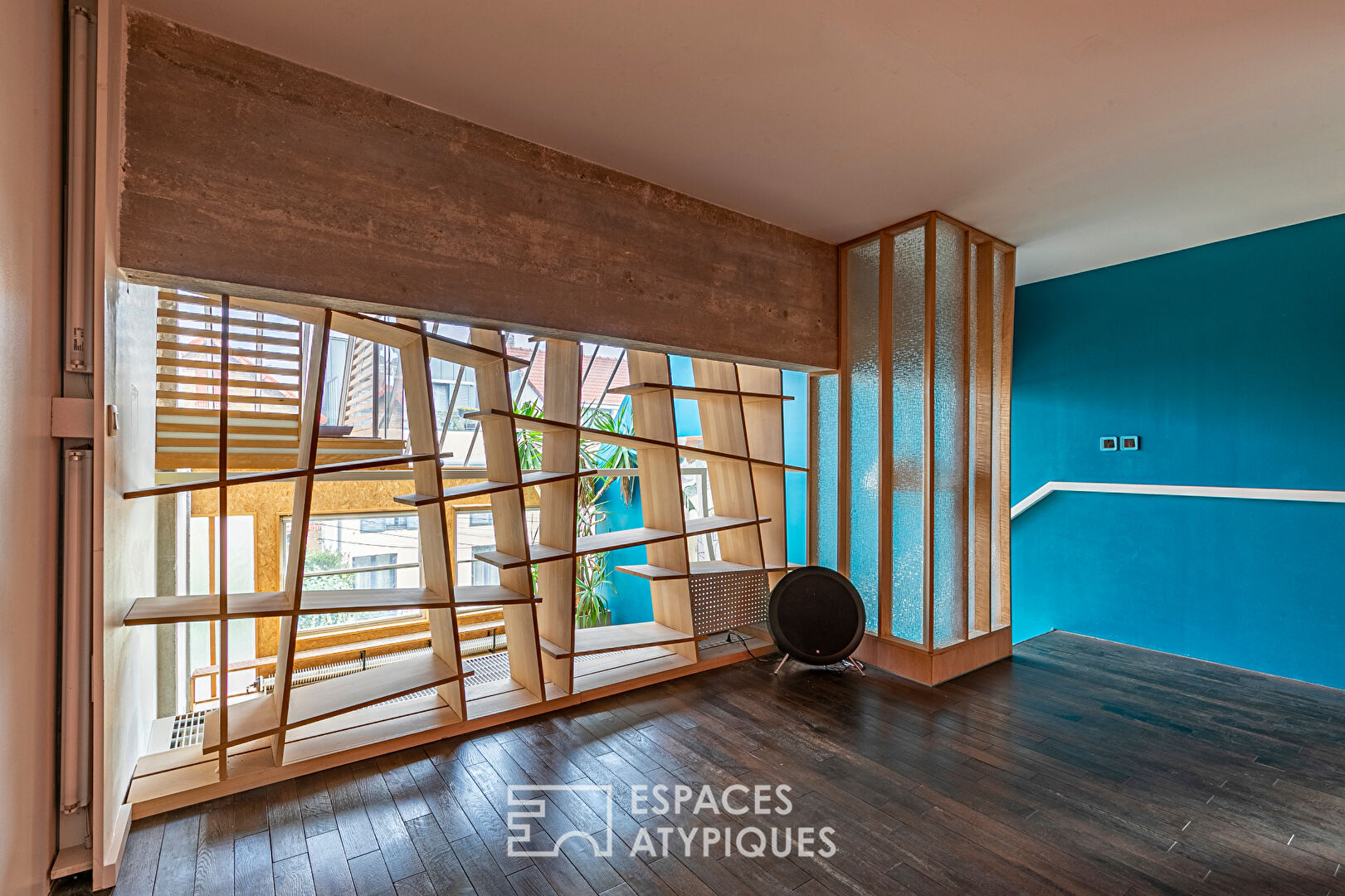 Artist’s loft with cascading glass roofs