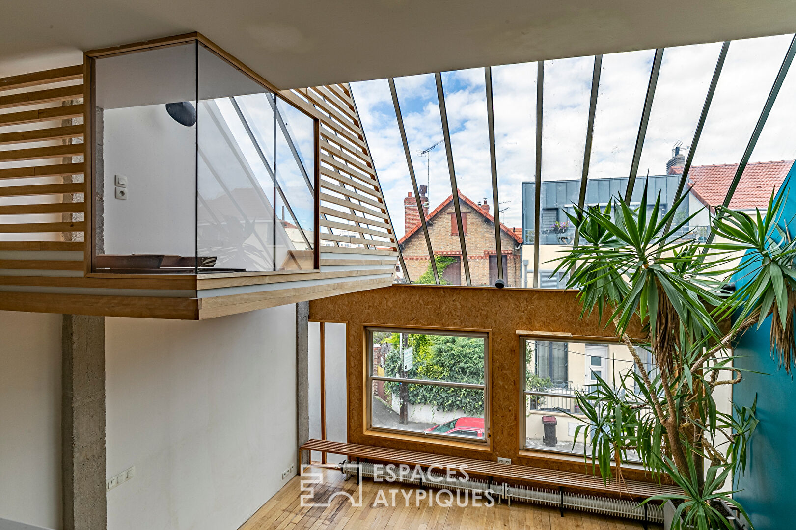 Artist’s loft with cascading glass roofs