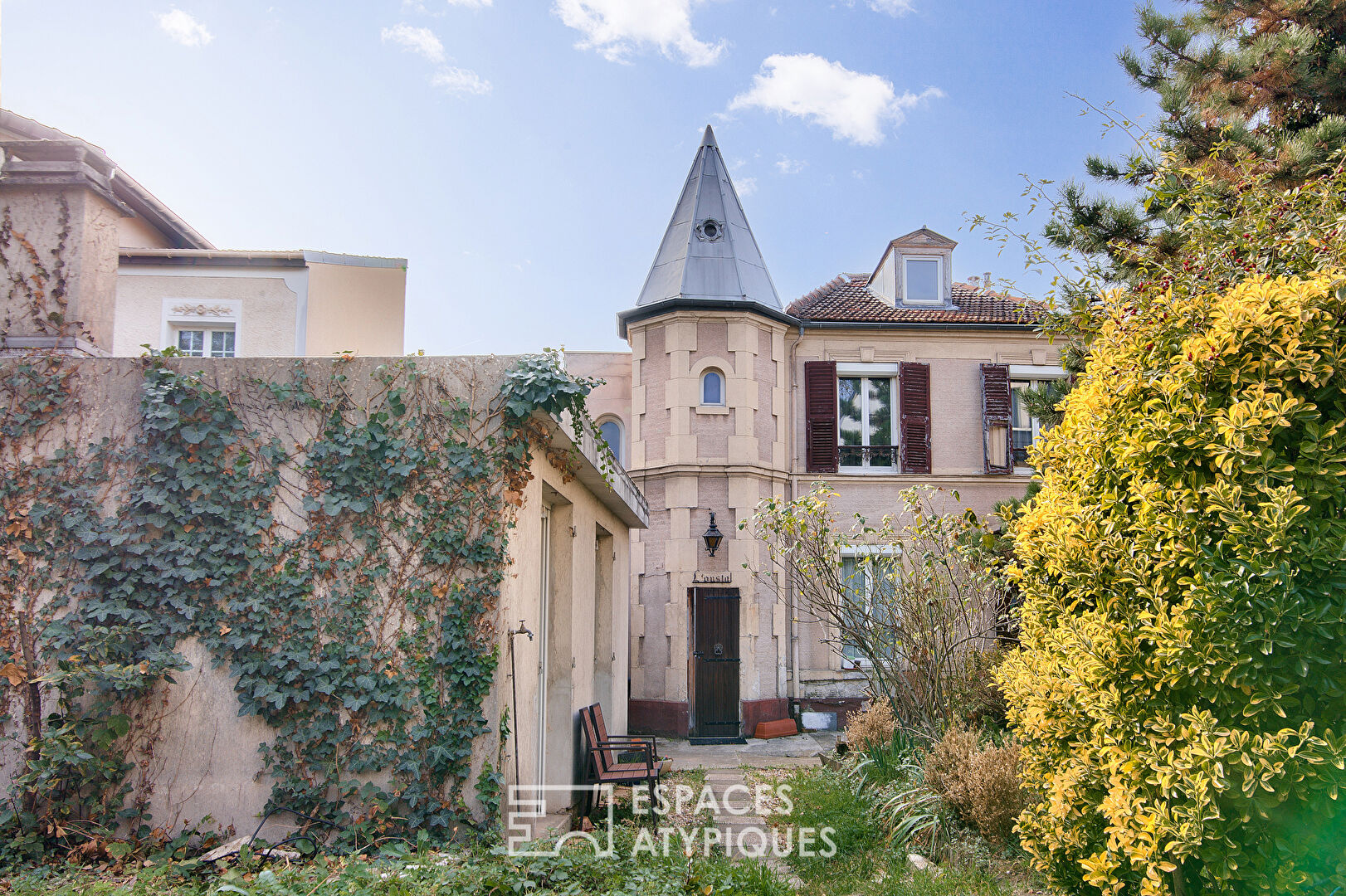 Victorian-inspired building with garden