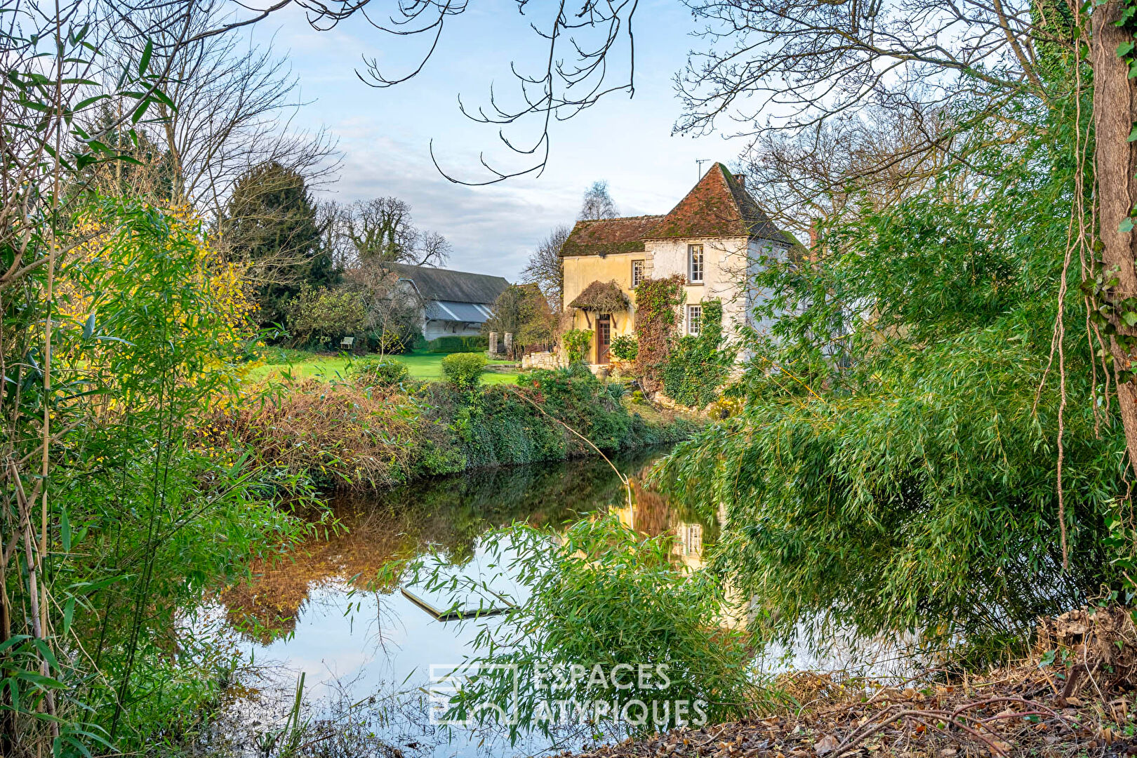 Historic family home with its sumptuous woods and pond.