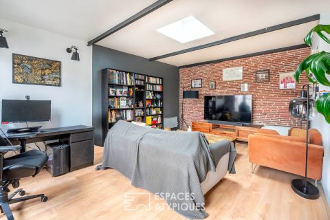 Loft-style apartment with balcony in a renovated former factory