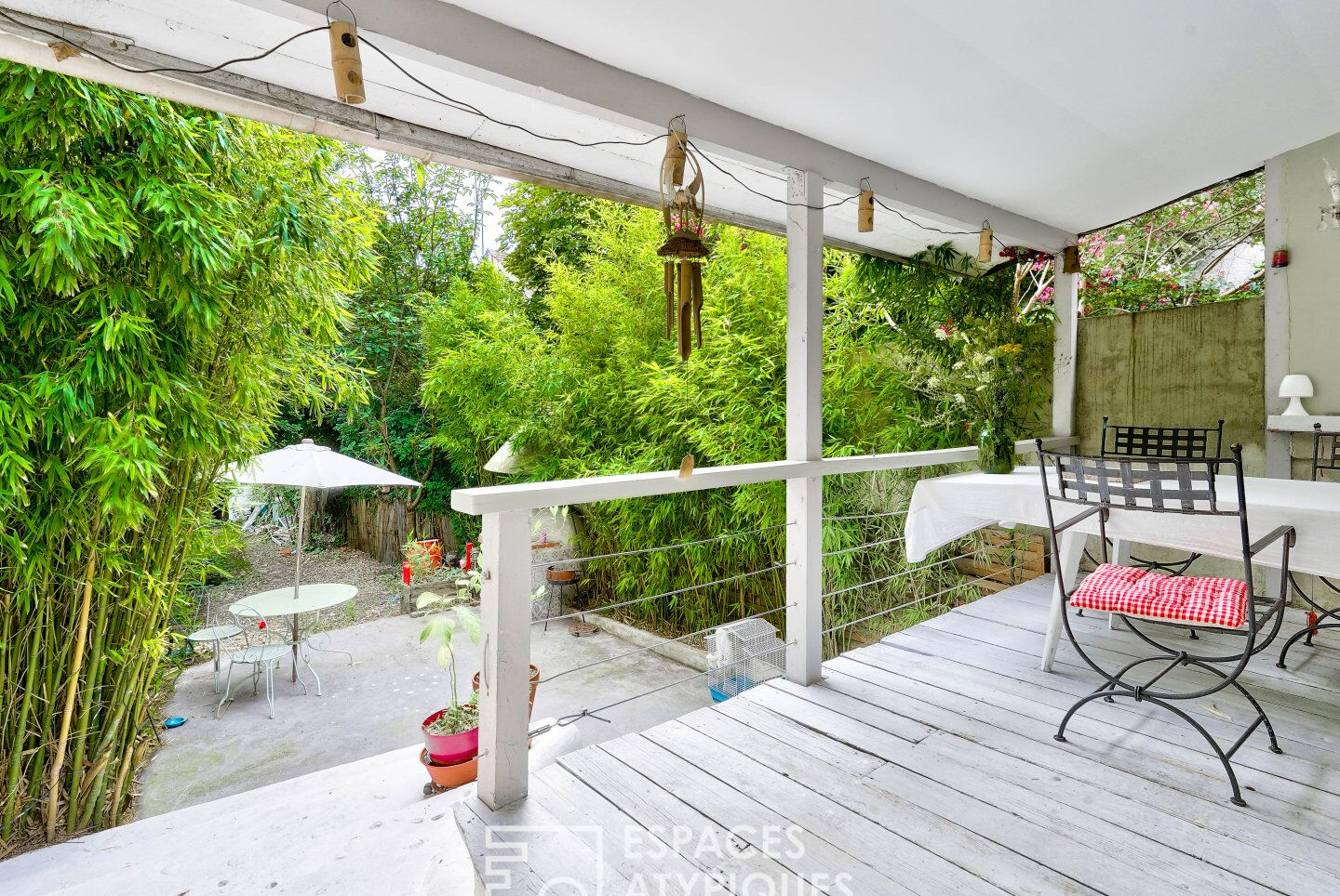 House with garden and wooden terrace