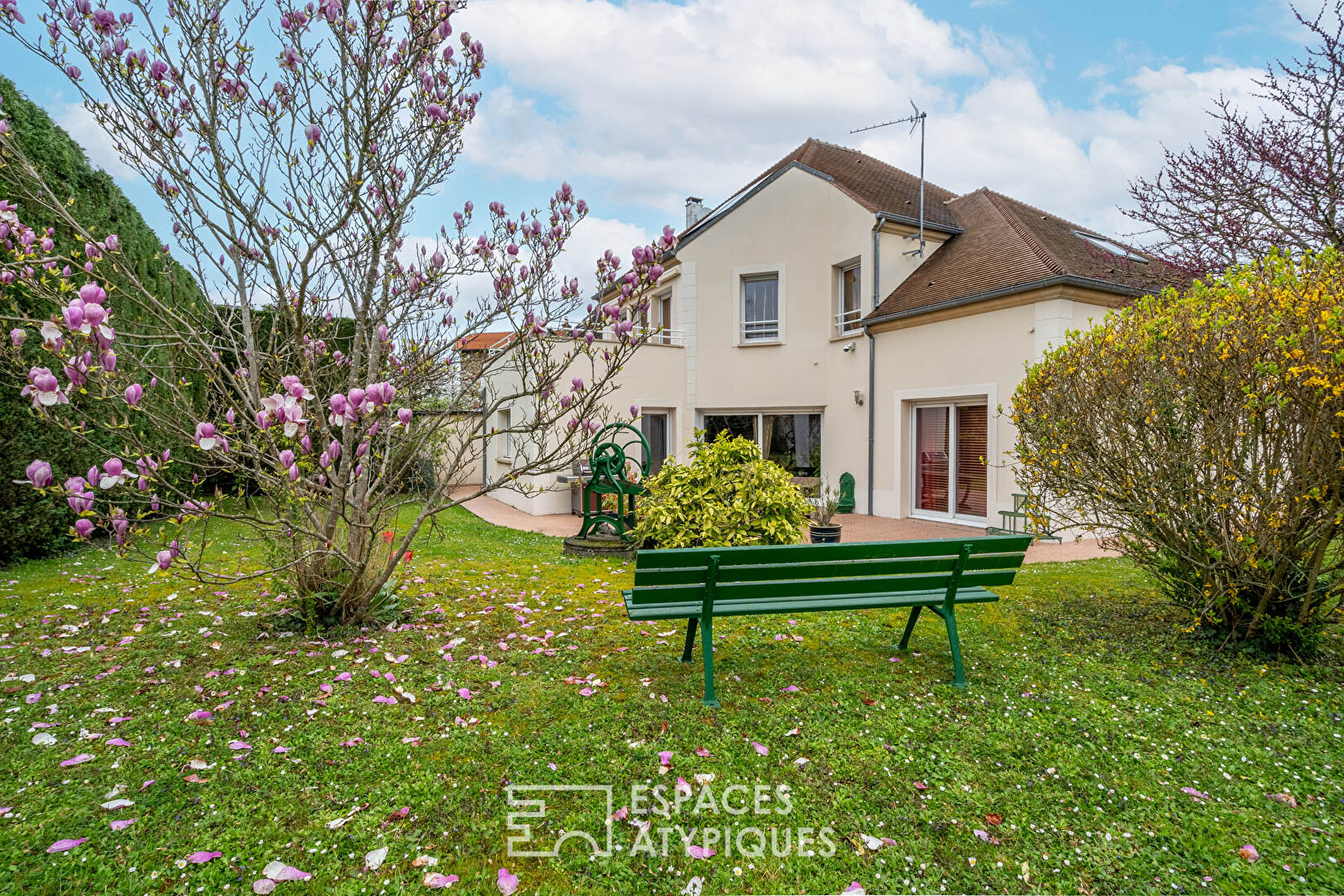 Modern house with landscaped garden and outbuilding