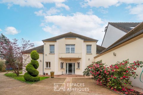 Modern house with landscaped garden and outbuilding