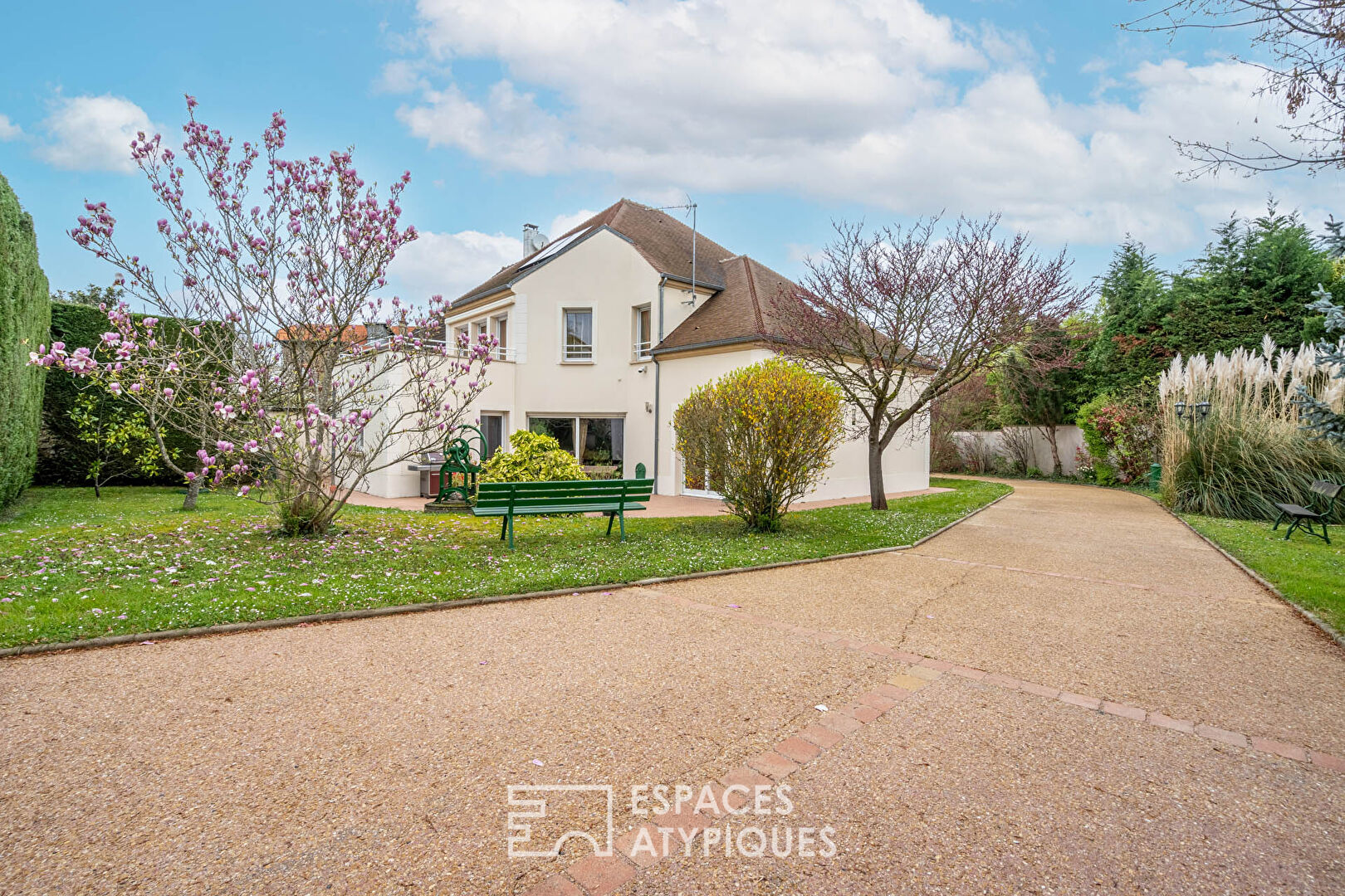 Modern house with landscaped garden and outbuilding