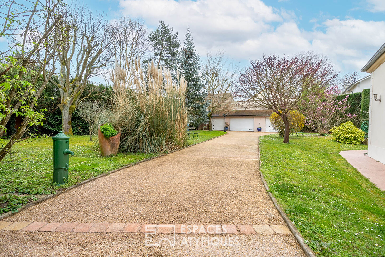 Modern house with landscaped garden and outbuilding