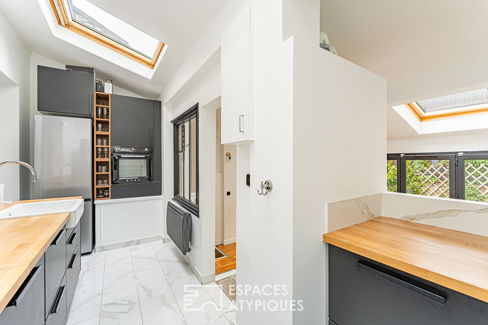 Maison réinventée avec jardin secret, au coeur d’Asnières