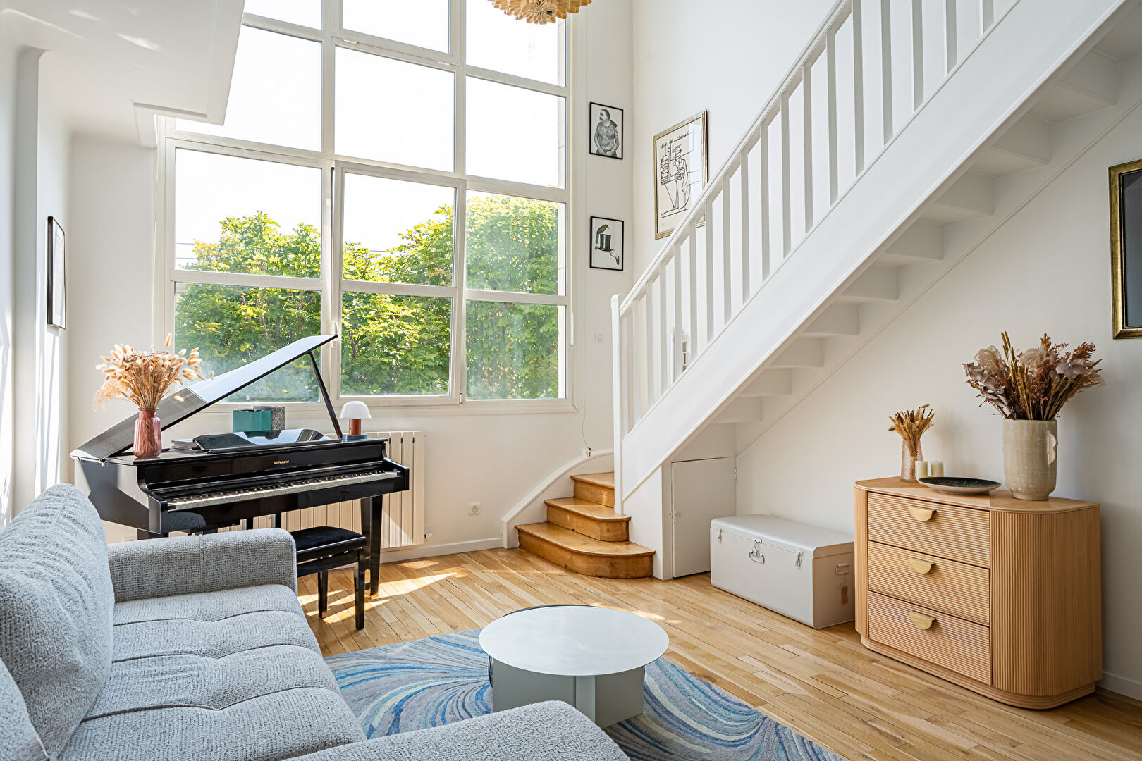 Family artist’s studio bathed in light and sheltered from view.