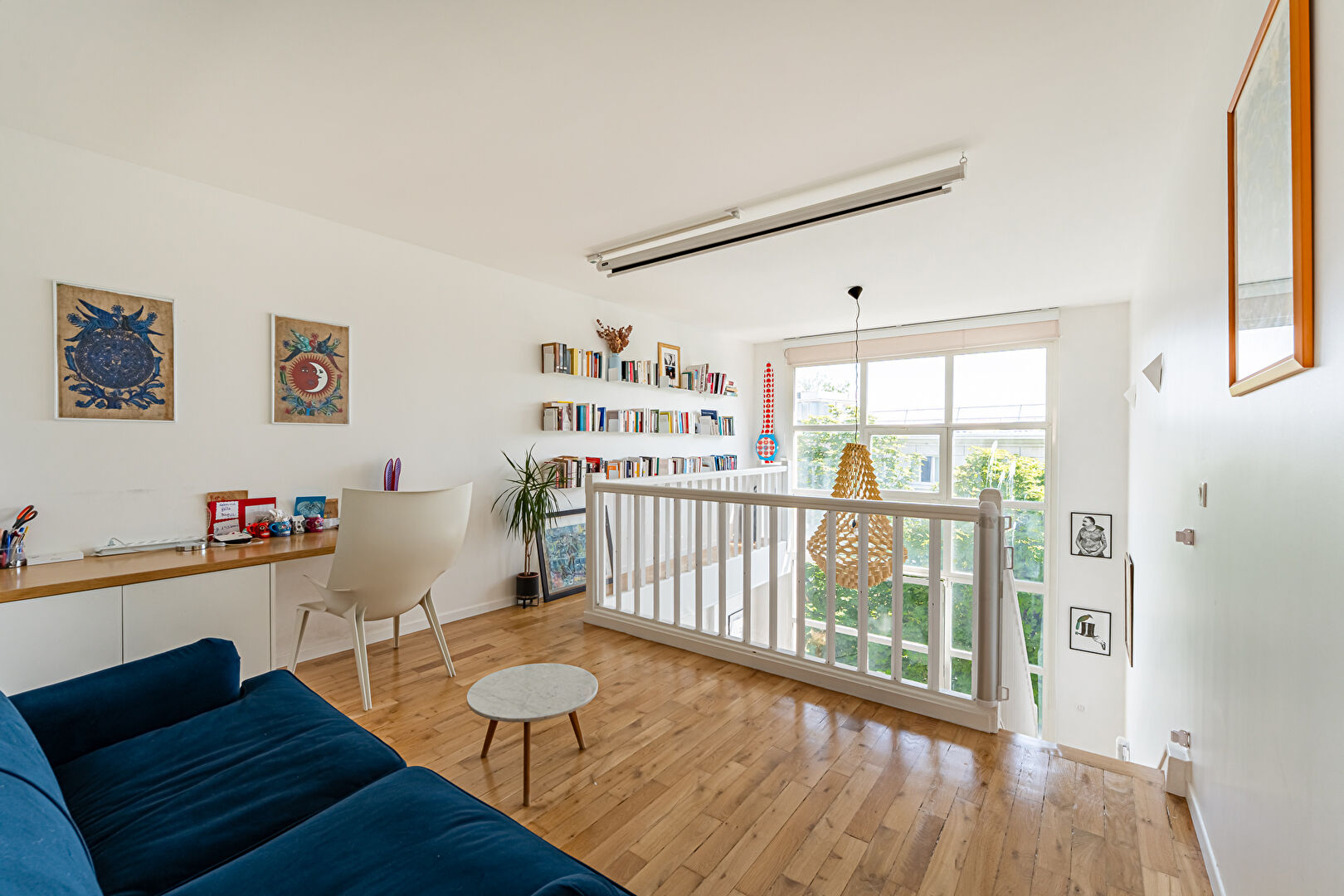 Family artist’s studio bathed in light and sheltered from view.