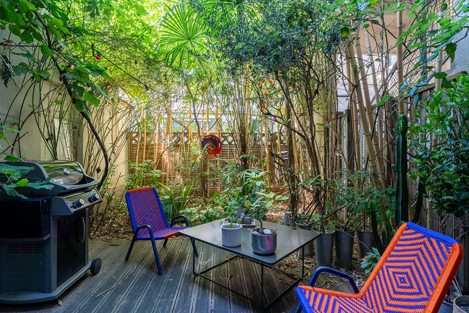 Architect-designed triplex with a house-style feel and a lush garden