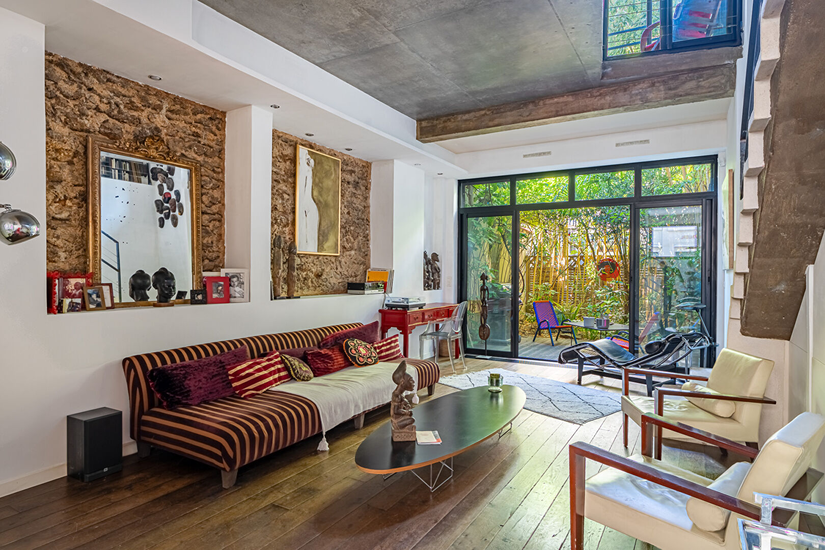 Architect-designed triplex with a house-style feel and a lush garden