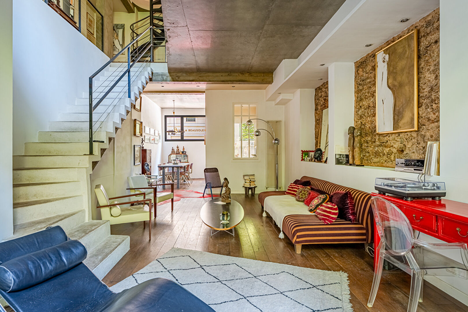 Architect-designed triplex with a house-style feel and a lush garden