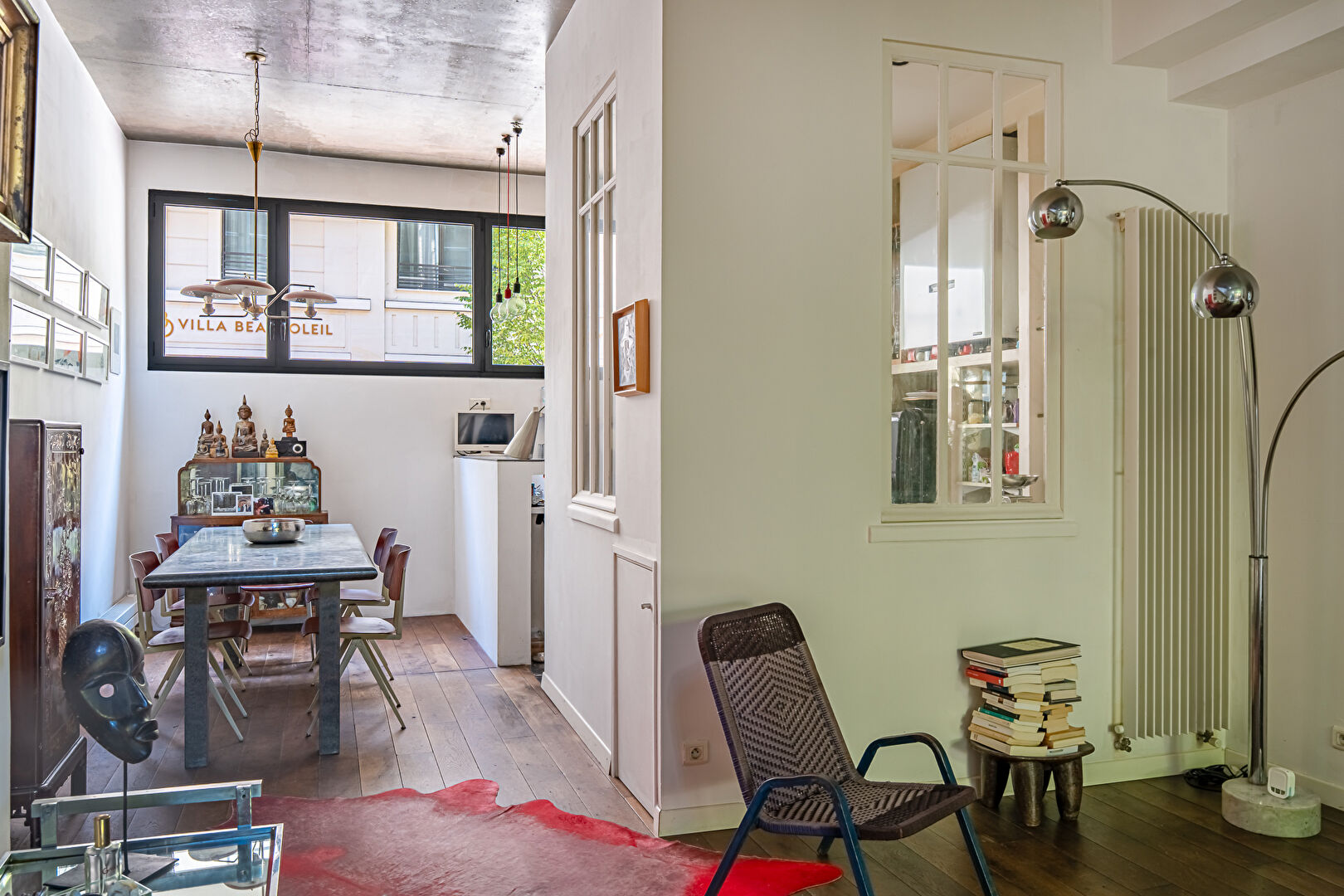 Architect-designed triplex with a house-style feel and a lush garden