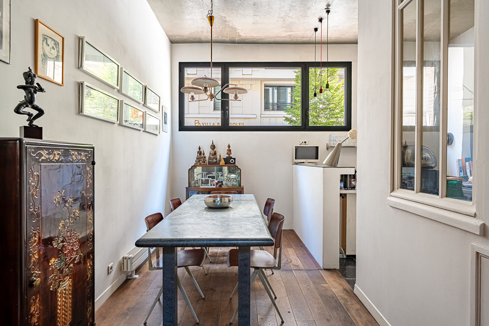 Architect-designed triplex with a house-style feel and a lush garden