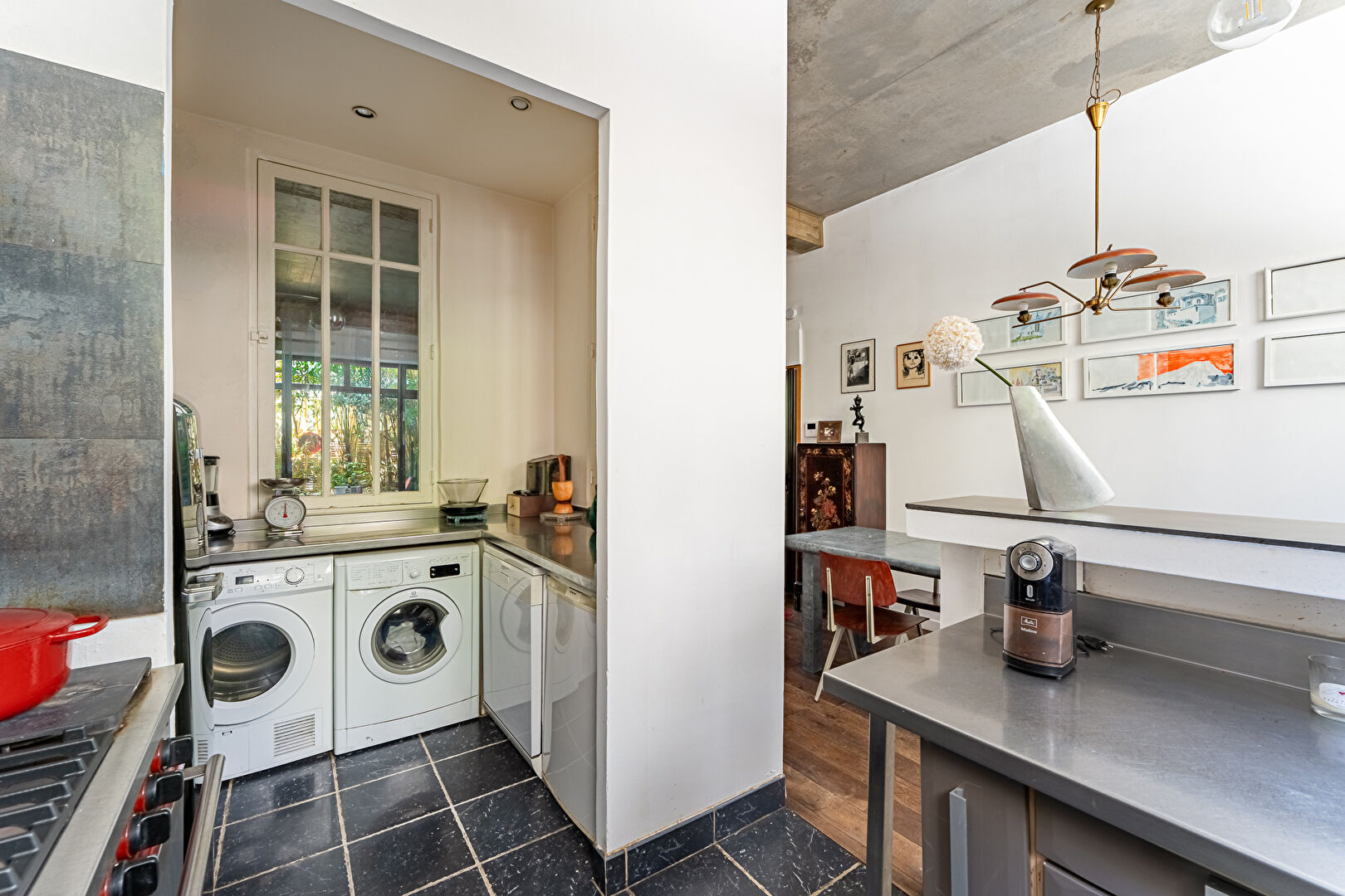 Architect-designed triplex with a house-style feel and a lush garden