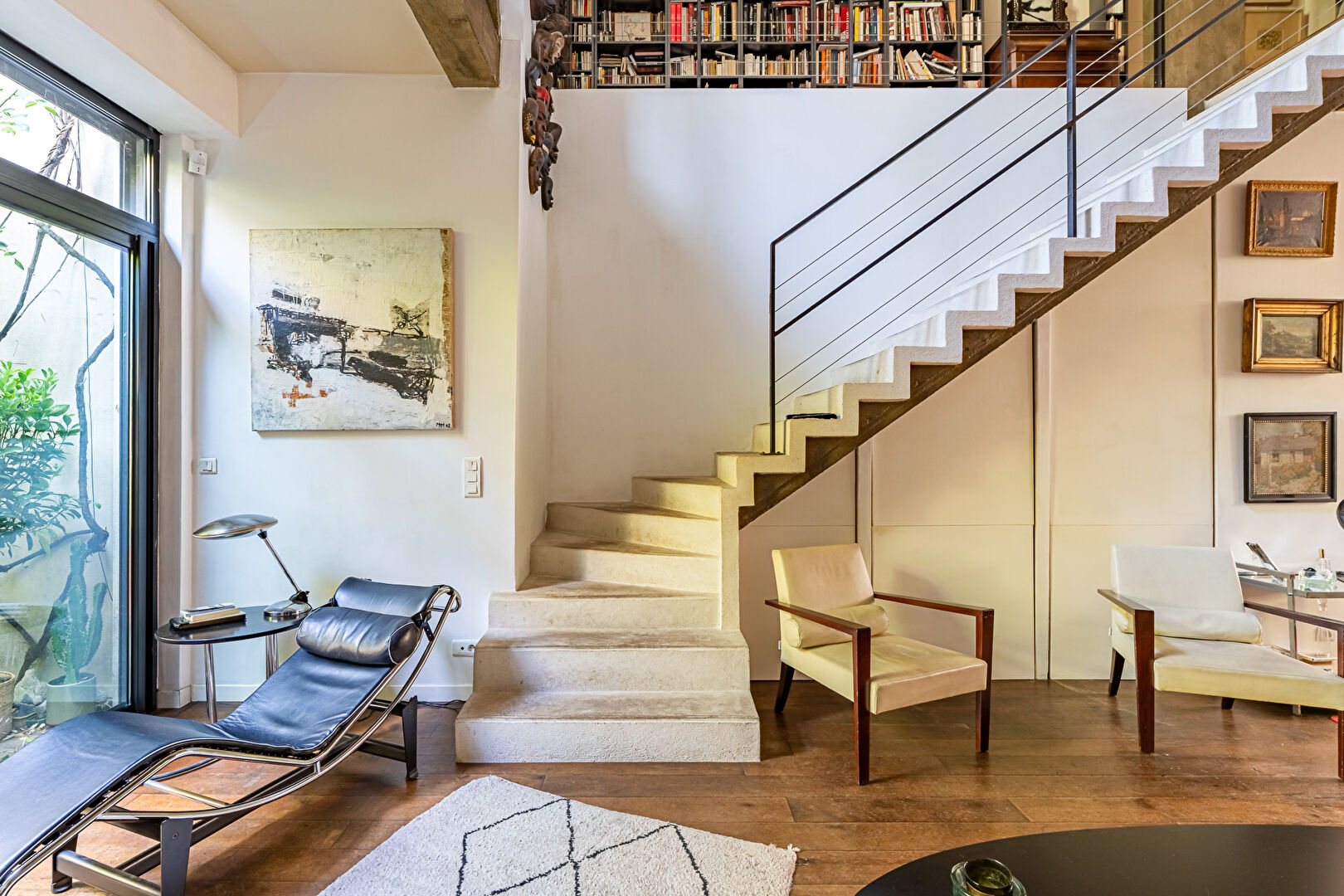 Architect-designed triplex with a house-style feel and a lush garden