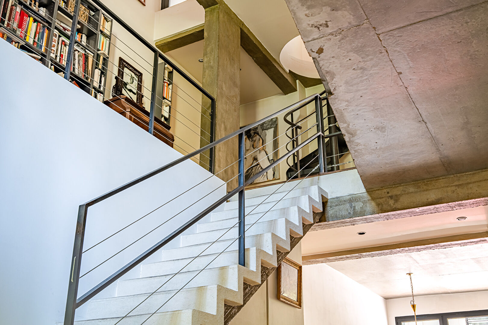Architect-designed triplex with a house-style feel and a lush garden