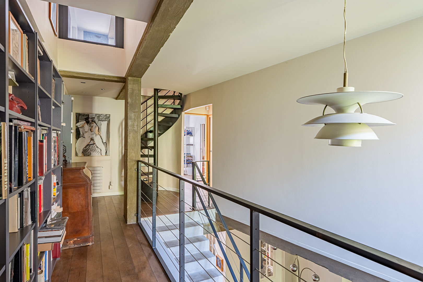 Architect-designed triplex with a house-style feel and a lush garden