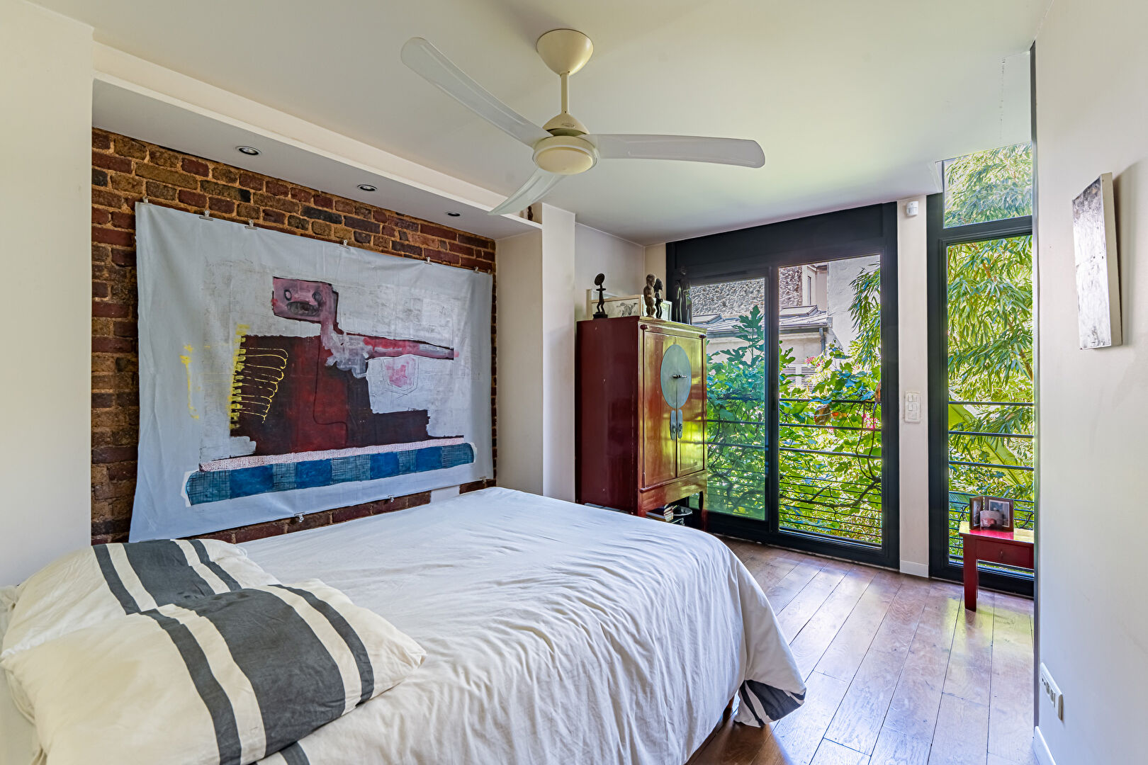 Architect-designed triplex with a house-style feel and a lush garden