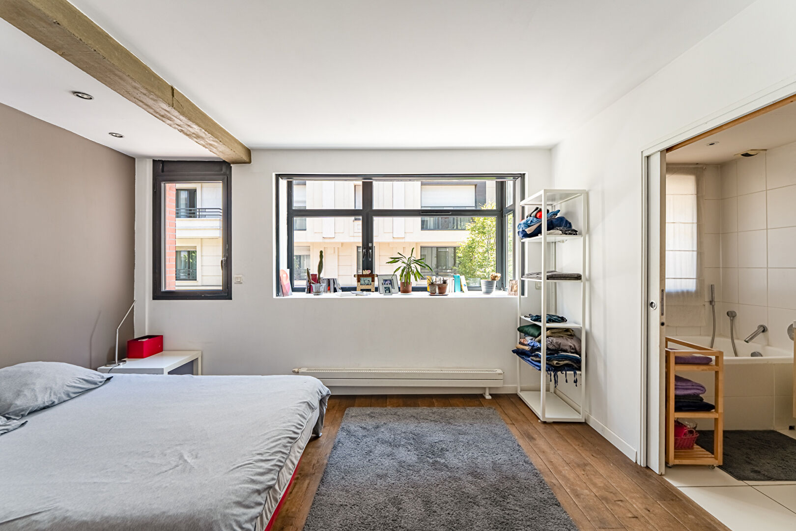 Architect-designed triplex with a house-style feel and a lush garden