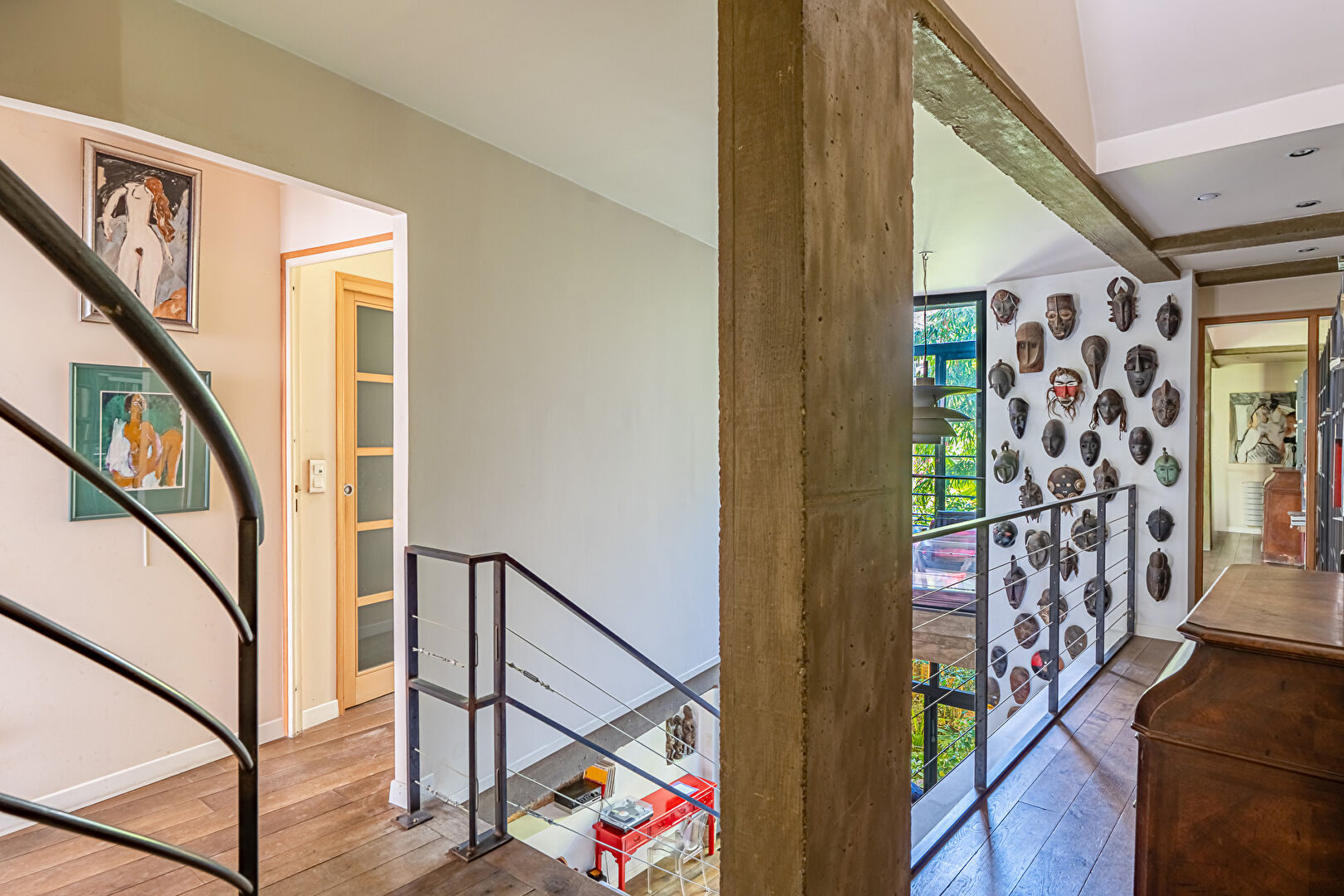 Architect-designed triplex with a house-style feel and a lush garden