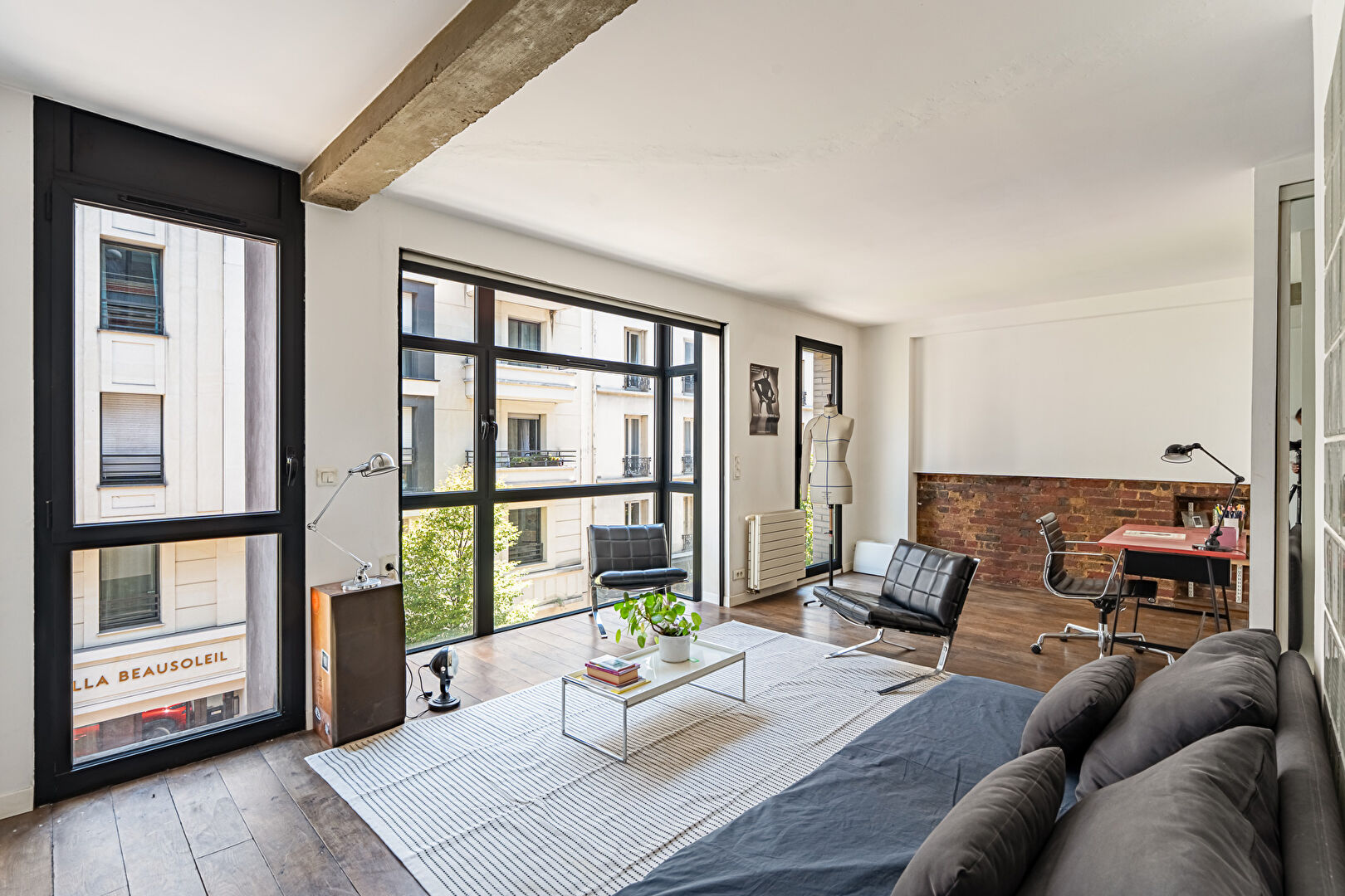 Architect-designed triplex with a house-style feel and a lush garden