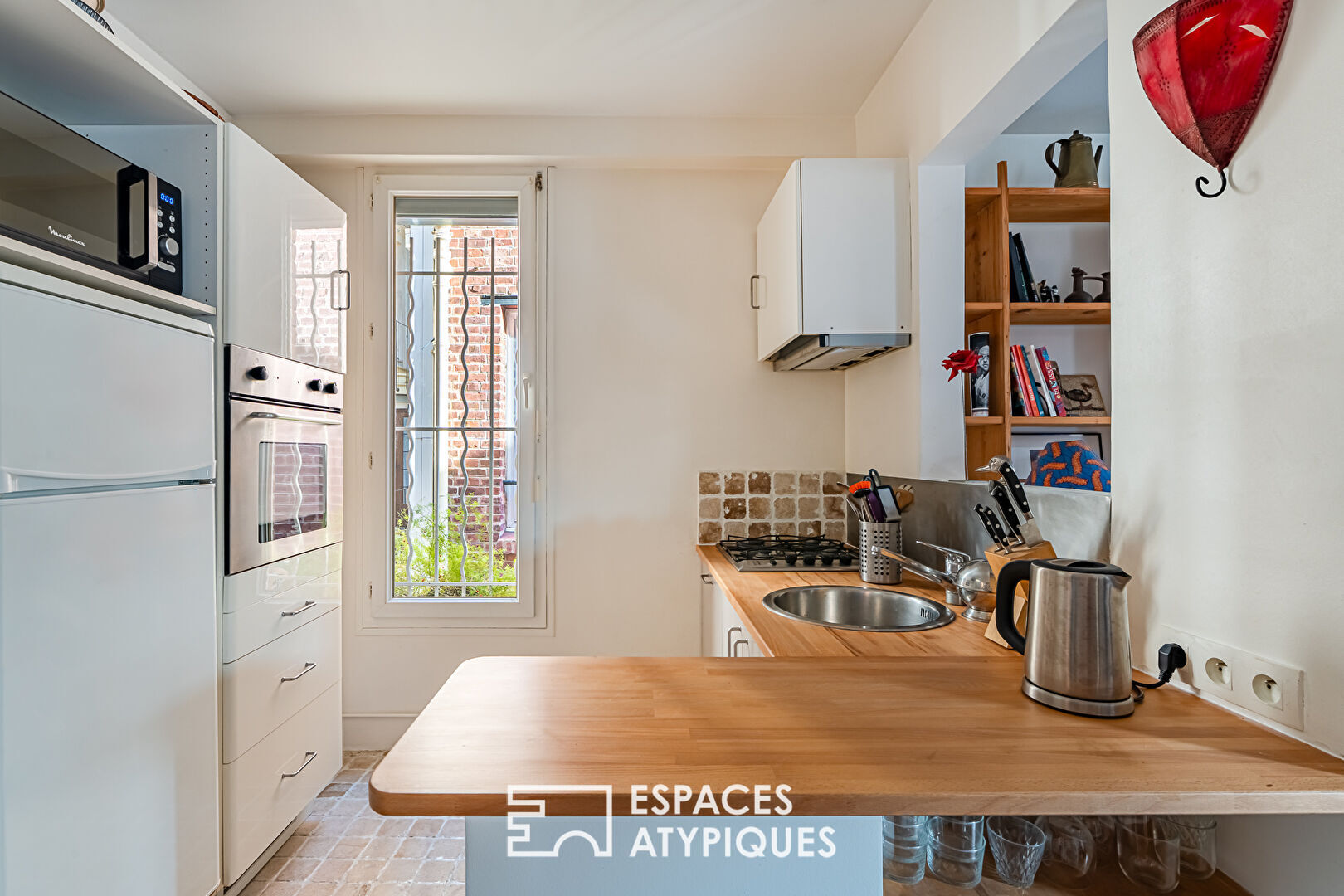 Duplex inversé comme une maison au coeur de Boulogne.