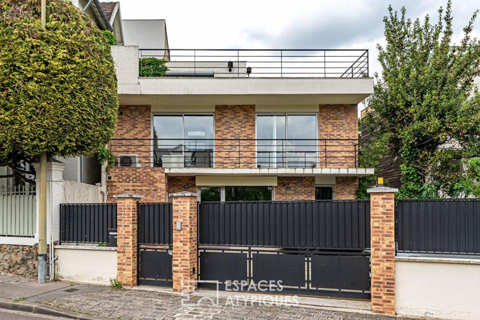 Bureaux transformables en maison-loft d'habitation avec toit-terrasse