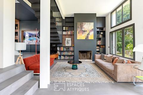 Maison transformée esprit loft avec terrasse et jardin
