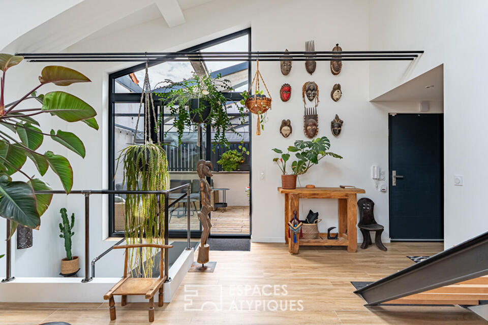 Loft en triplex avec terrasse et courette