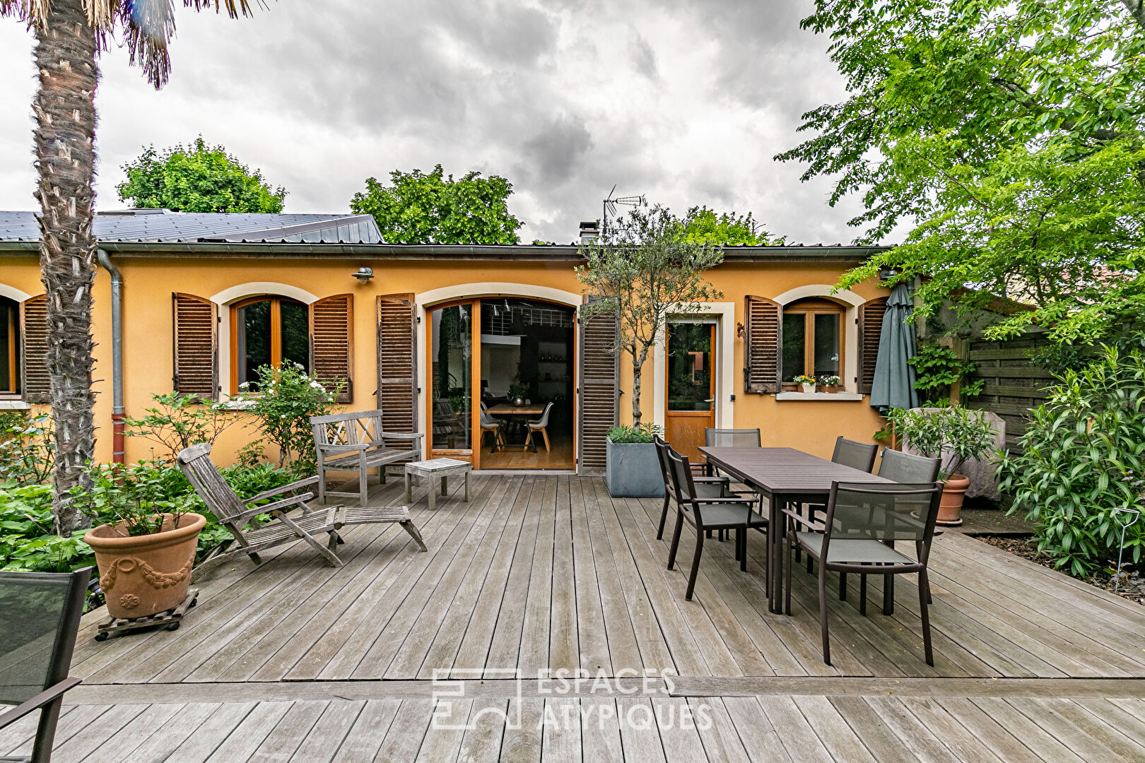 Former garage converted into a Loft with landscaped garden